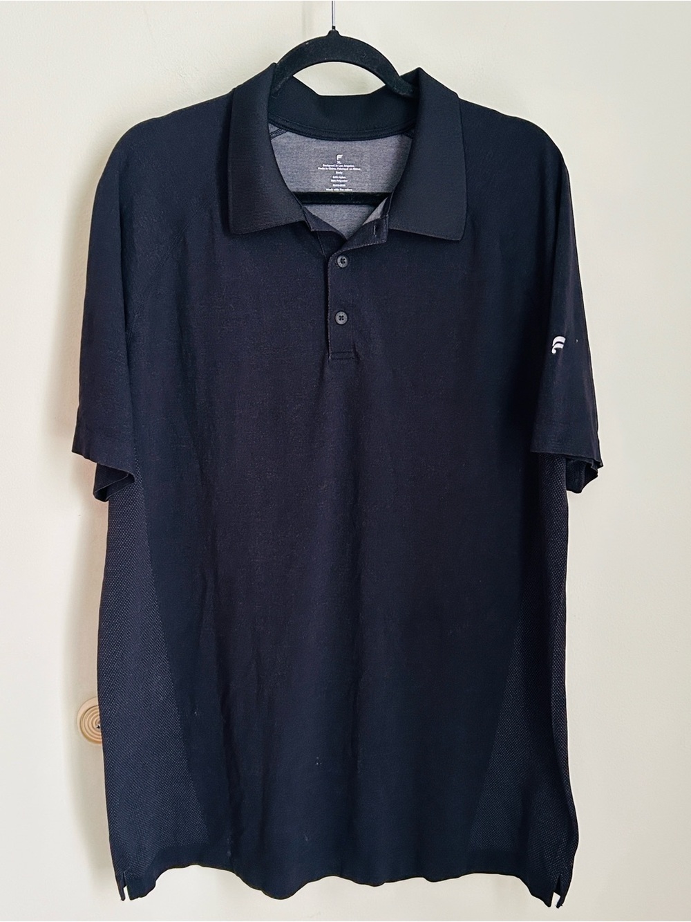 Fabletics Black Men's Polo with Subtle Sleeve Emblem